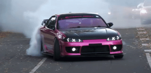 Pink Car Driving With Smoke From Tires