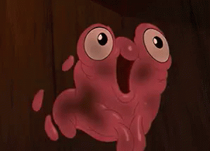 Pink Cartoon Character With Big Eyes and Mouth Open