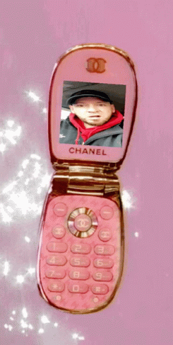 Pink Chanel Flip Phone on Pink Background