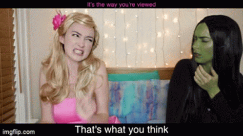 Pink Dress Woman Talking To Green Woman GIF