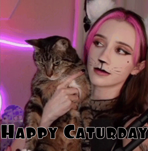 Pink-Haired Girl Holding Cat with Cat-Face Paint