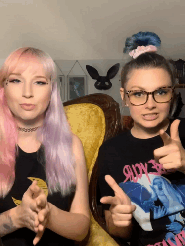 Pink-Haired Girl Thumbs Up Next to Glasses Girl