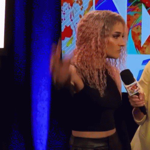 Pink-Haired Woman Holding Microphone GIF