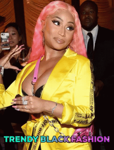 Pink-Haired Woman in Yellow Jacket Saying Trendy Black Fashion