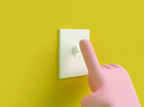 Pink Hand Pressing Light Switch On Yellow Wall GIF