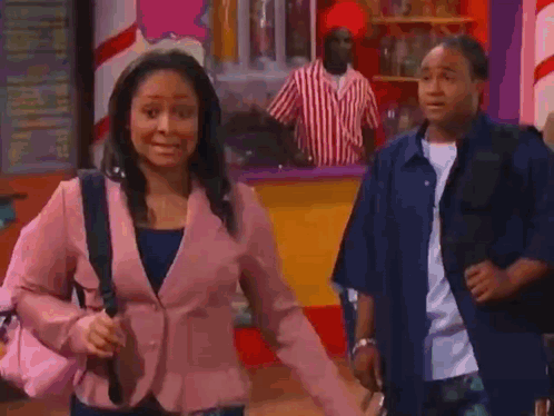 Pink Jacket Woman And Blue Shirt Man At Ice Cream Parlor GIF