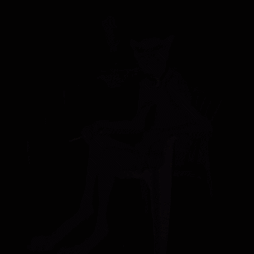 Pink Panther Smoking Cigarette Sitting on Chair