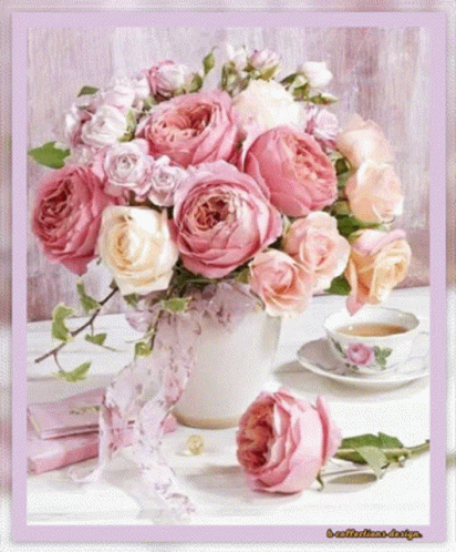 Pink Rose Bouquet Next To Tea Cup GIF