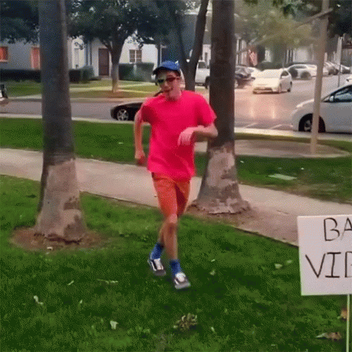 Pink Shirt Man Running by Ba Vi Sign