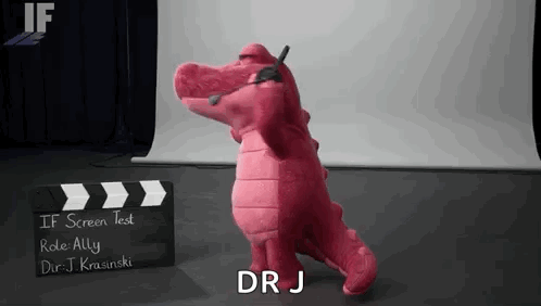 Pink Stuffed Alligator in Front of Clapper Board