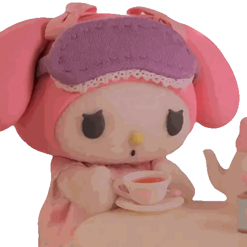 Pink Stuffed Animal Holding Tea