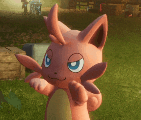 Pink Stuffed Animal with Blue Eyes in Grassy Field