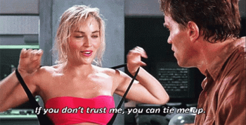 Pink Top Woman Talking to Brown Shirt Man