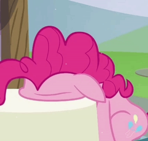 Pinkie Pie Laying on White Cake