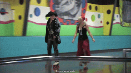 Pirate and Woman in Red Dress Rollerblading