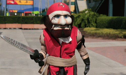 Pirate Mascot Holding Knife Red Vest GIF
