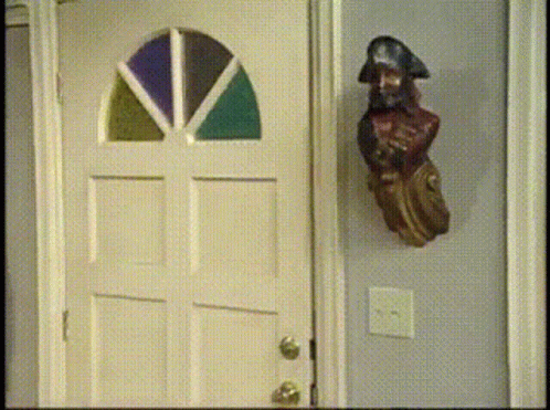 Pirate Statue Near Stained Glass Door