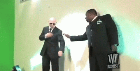 Pitbull And His Bodyguard Shoulder Brush GIF