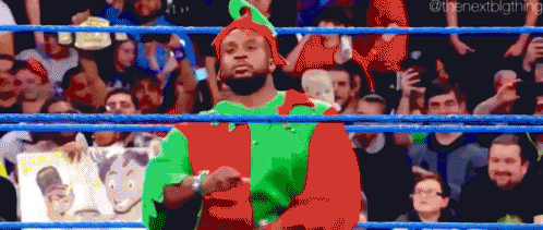 Pixel Art Wrestler In Red And Green Elf Outfit GIF