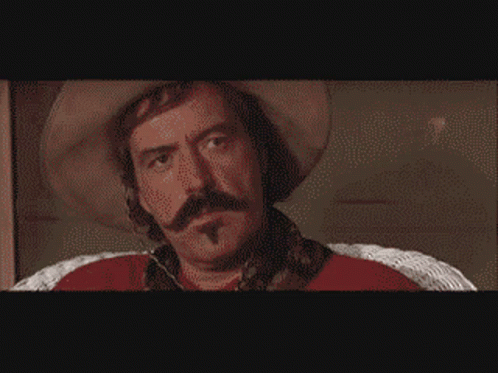 Pixelated Cowboy Man With Mustache Says Bye