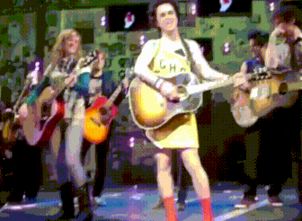Pixelated Woman Playing Guitar In L.H.A. Shirt GIF