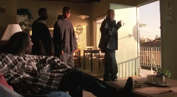 Plaid Shirt Man Laying on Couch Men Standing