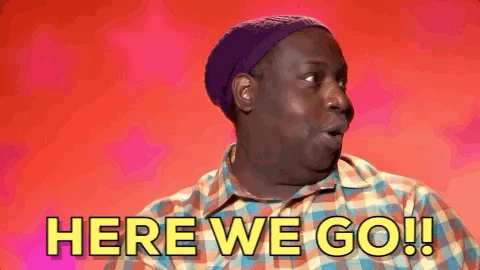 Plaid-Shirt Man Purple Hat Saying Here We Go