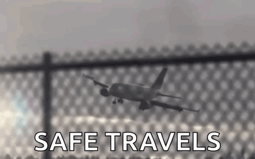 Plane Flying Over Fence With Safe Travels