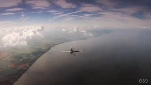 Plane Flying Over Water Number 089