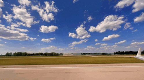 Plane on Runway Blue Sky White Clouds