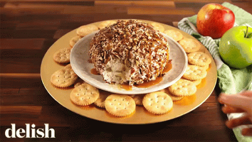 Plate Of Crackers And Apples Saying Delish GIF