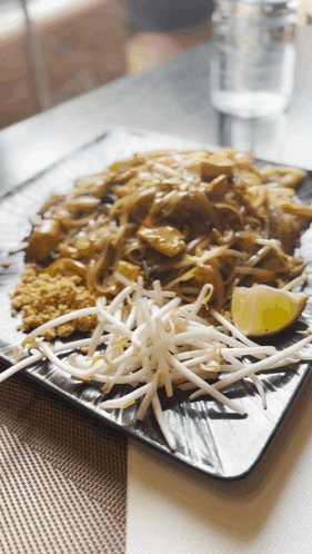 Plate Of Food With Bean Sprouts And Lime Slice GIF
