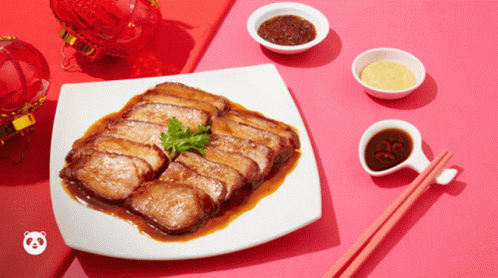 Plate of Food with Chopsticks and Sauces