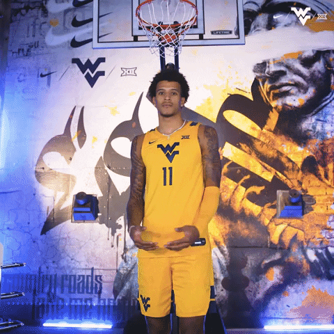 Player From Mountaineers Pointing And Flexing His Jersey GIF