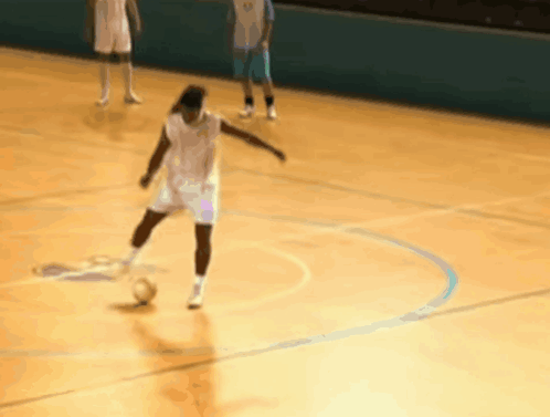 Player Kicks Ball, Another Watches GIF
