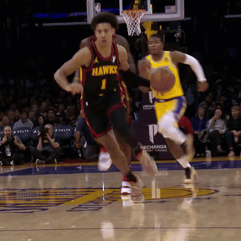 Player Number 1 For The Hawks Is Dribbling The Basketball GIF