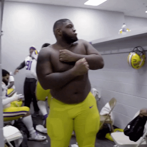 Player Under Ed Orgeron Biting Burger GIF