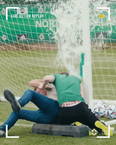 Playful Athletes Drenched With Water GIF
