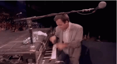 Playful Billy Joel Playing Piano GIF