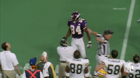 Playful Randy Moss Flexing Muscles GIF