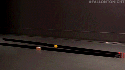 Playful Red Yellow White Dominos Falling GIF