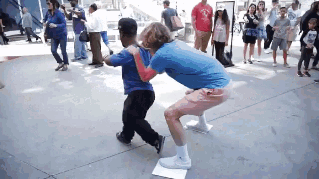 Playing With Midget Running Around Crowd GIF