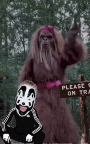 Please Stay On Trail Sign Next To Bigfoot GIF