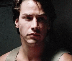 Point Break Keanu Reeves Poker Face GIF