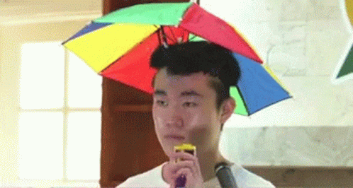 Poker Face Guy Using Party Popper GIF