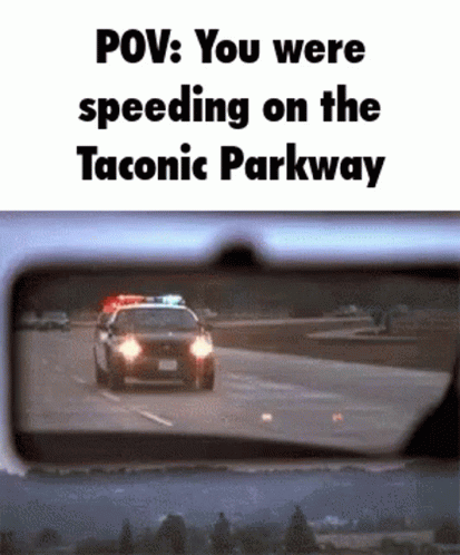 Police Car Driving Down Highway