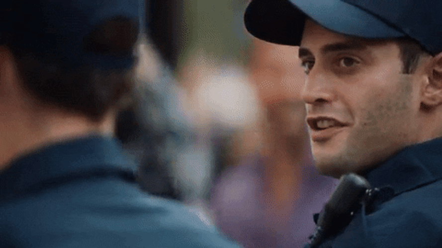Police Cop Smiling Head Shake GIF