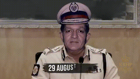 Police Man Wearing Hat With 29 August