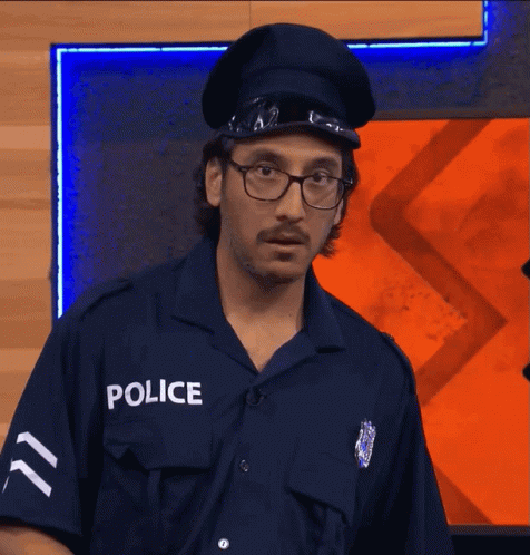 Police Officer Dancing in Front of Take Out Restaurant
