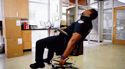Police Officer Head Down In Office Chair GIF